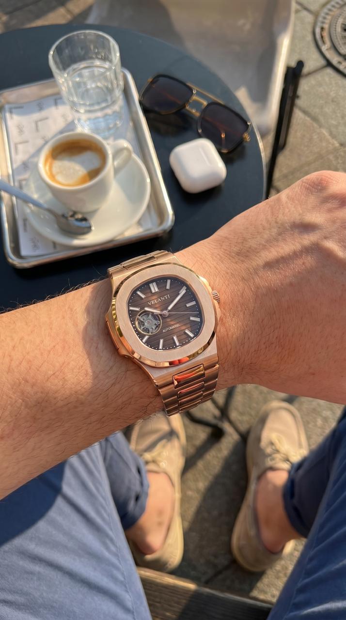 Customer wrist photo for Velanti Milano Nautvel Rose Gold Chocolate Open Heart review — café setting
