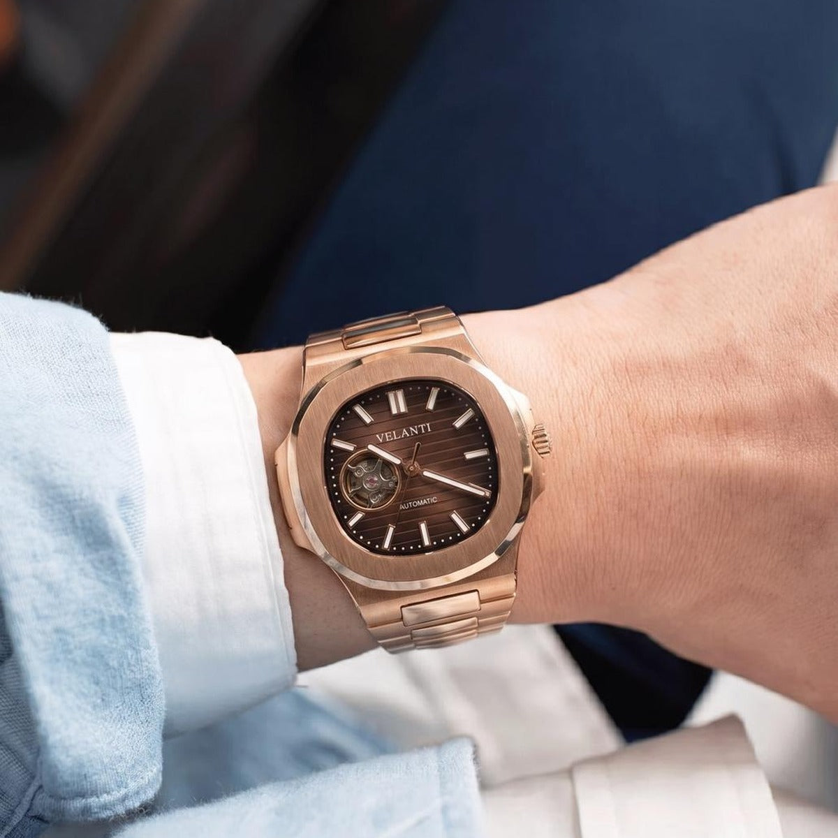 Customer wrist photo for Velanti Milano Nautvel Rose Gold Chocolate Open Heart review — blue cuff setting